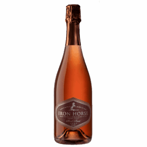 A bottle of Iron Horse sparkling rosé wine with a copper foil top on a plain light background.
