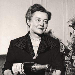 Lily Bollinger pouring champagne into a glass