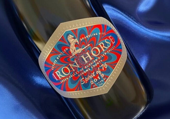 spirit of 76 bottle image on a blue background